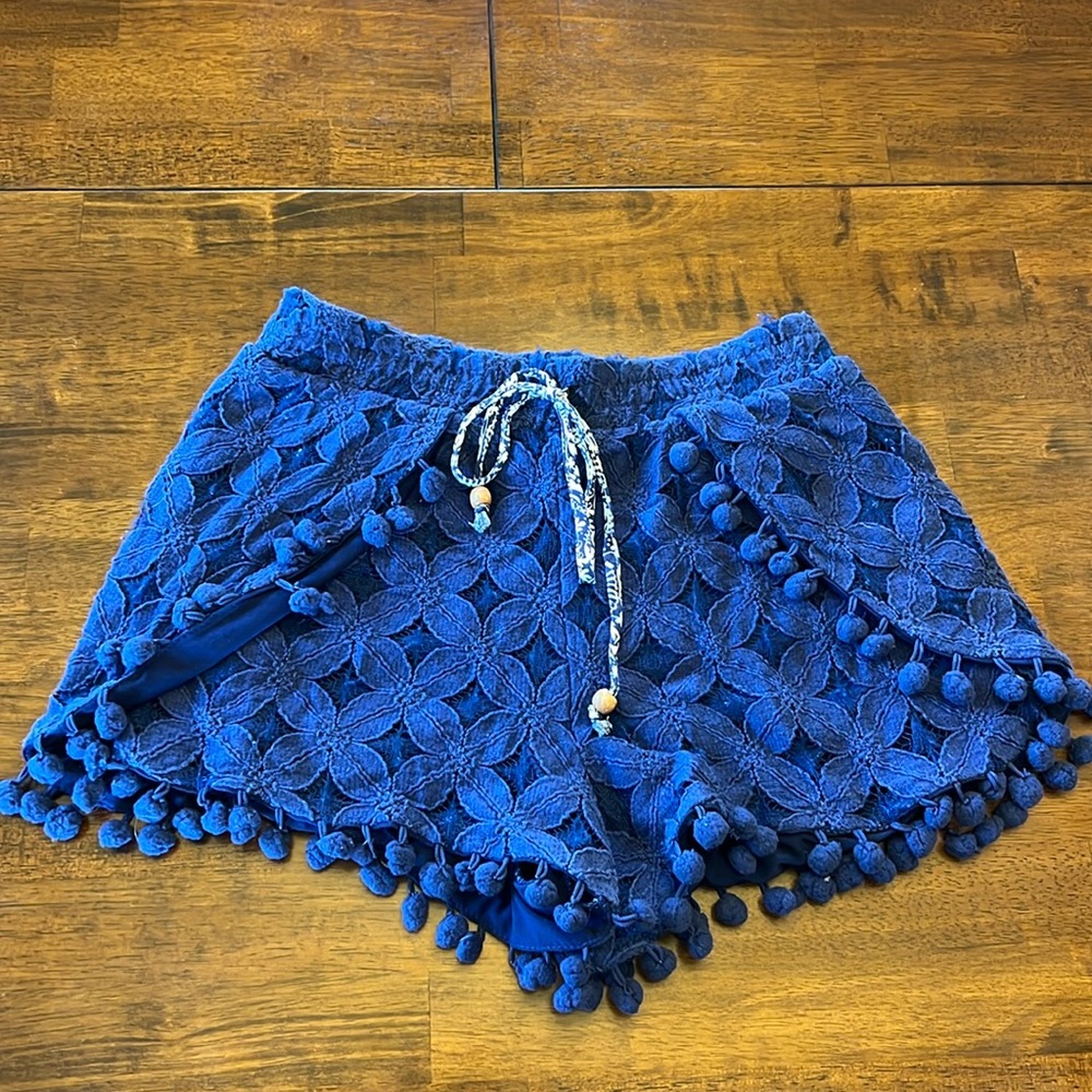 Navy shorts with pom poms